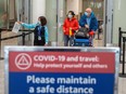 FILE: Travellers from an international flight are directed to the COVID-19 testing area as part of Canada's new measures against the coronavirus disease (COVID-19), at Toronto Pearson International Airport in Mississauga, Ontario, Canada February 24, 2021.