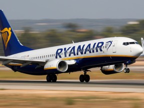 FILE PHOTO: A Ryanair Boeing 737-800 airplane takes off from the airport in Palma de Mallorca, Spain, July 29, 2018.