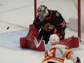 Ottawa Senators goalie Filip Gustavsson makes a save on a shot from Calgary Flames center Sam Bennett in the third period at the Canadian Tire Centre, March 22, 2021.