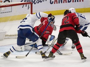 Ottawa Senators Thomas Chabot defends as Toronto Maple Leafs center Alex Galchenyuk shoots on Ottawa Senators goalie Anton Forsberg in overtime at the Canadian Tire Centre.