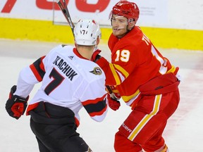 Ottawa Senators Brady Tkachuk battles against his brother Matthew Tkachuk of the Calgary Flames during NHL hockey in Calgary on Sunday March 7, 2021