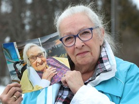 Rose Anne Reilly displays a photo of her late mother, Rose, who was residing in a long-term care facility when she died.