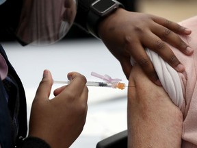 Ottawa seniors receive their vaccine from Ottawa Public Health at the The Albion-Heatherington Recreation Centre in Ottawa on March 5.