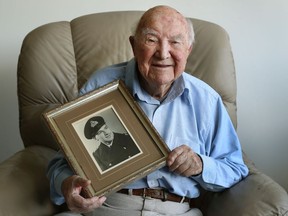 Ken Micklethwaite poses for a photo in his home in Ottawa Tuesday June 4, 2019. Ken Micklethwaite, 100, is one of this city's only surviving veterans of D-Day.