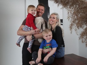 Marc Methot, his wife Ellie and kids Jack and Ivy pose at their home in Manotick.