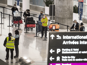 Files: Travelers entering the country at Pearson International Airport in Toronto in February, 2021.