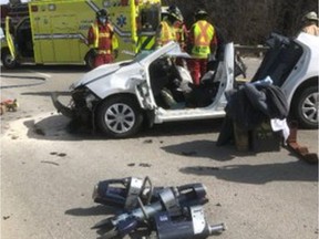 Emergency crews had to use power equipment to extricate a female passenger from this car after it struck a tractor trailer rig from behind on Highway 105 on Tuesday.