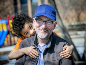 Seven-year-old Miles Gollner and his dad, Adrian Gollner, at Cambridge Street Community Public School on Sunday, March 21, 2021. Miles spent kindergarten at Cambridge, but transferred to Devonshire this year for Grade 1 so he could attend French immersion.