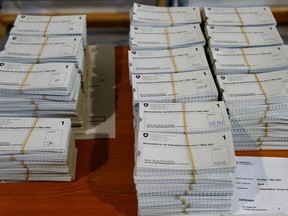 Piles of "Yes" and "No" ballots sit on a table at the district election office Stadtkreis 3 on the day of a Swiss referendum on banning burqas and other facial coverings in Zurich, Switzerland on Sunday.