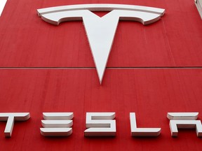 The logo of car manufacturer Tesla is seen at a branch office in Bern, Switzerland.