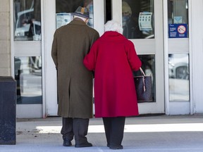 Ottawa residents 80 and older arrive at the Nepean Sportsplex for their appointments to receive the COVID-19 vaccine on Monday, March 15, 2021.