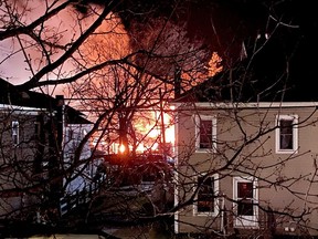 Awakened by the light from the flames, Melissa Rainville snapped this photo from her bedroom window on Friday at 1:26 a.m. in Spencerville. The fire destroyed her brand new business, Trinkets Boutique, and left nine tenants homeless.