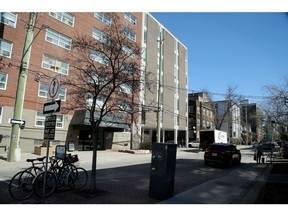 331 Cooper Street (grey in centre) in downtown Ottawa is a mid-rise office building that the owner wants to transform into a residential apartment building. Julie Oliver/Postmedia