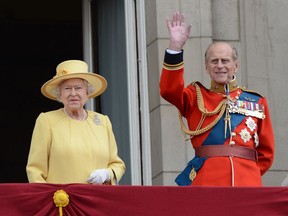 Queen Elizabeth with Prince Philip, Duke of Edinburgh, in 2012, watching the Trooping the Colour ceremony from the Balcony at Buckingham Palace.