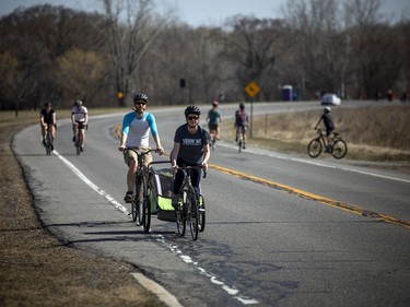 Capital-area residents took advantage of the extra space to safely cycle on the Sir George-Étienne Cartier Parkway on Saturday. The National Capital Commission closed part of that parkway as well as parts of the Sir John A. Macdonald Parkway and Queen Elizabeth Driveway to vehicle traffic for part of the day to allow for individual exercise. The closures are to be in effect again on Sunday.