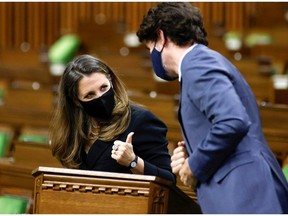 Finance Minister Chrystia Freeland gives a thumbs up to Prime Minister Justin Trudeau in the House of Commons after the spring budget presentation. MPs have too little power, the PMO, too much.