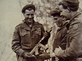 Lieut. Mike Levy (left) inspects a captured submachine gun in Korea, 1951. As the lieutenant of 10 Platoon, D Company, 2 PPCLI, Levy made the call to bring down artillery on his own position during the Battle of Kap'yong.