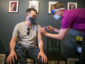 Colin Roberts received his vaccine from University of Ottawa medical student Richard Nadj Saturday morning. Dr. Nili Kaplan-Myrth along with a group of medical students set up Jabapalooza, a vaccine clinic in the Glebe Saturday, April 24, 2021.