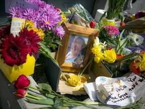 People paid their respects, left chalk notes, flowers and cookies for Carl Reinboth, a harm reduction worker at the Somerset West Community Health Centre, who was killed Friday.