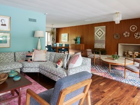 Two upholstered benches were remade into a coffee table placed in front of the fireplace.