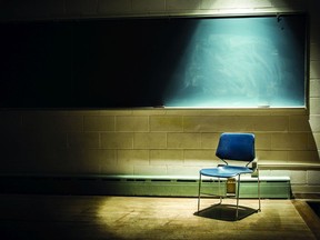 FILE: A chair sits in an empty classroom.