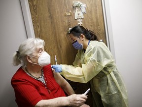 A senior gets a vaccine at an independent seniors' residence in Toronto on April 1.