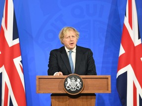 Prime Minister Boris Johnson, gives a media briefing on COVID-19 in Downing Street on Monday in London, England. The UK is set to allow a wide range of businesses to reopen across England on April 12, including non-essential shops, barbers and outdoor hospitality venues.