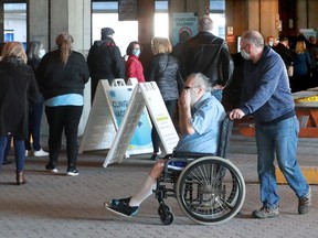 People over 55 line up for their COVID-19 vaccine outside the Palais Des Congres Thursday morning. In addition to taking thousands of appointments, there was also a lineup for walk-in vaccinations.