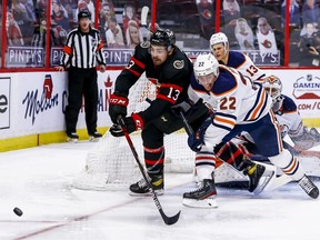 Ottawa Senators left wing Nick Paul battles Edmonton Oilers defenceman Tyson Barrie for a looser puck during third period NHL action at the Canadian Tire Centre.