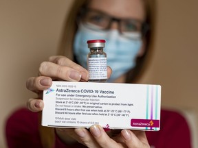 Veronica Ouellette, office administrator for Dr. Nilli Kaplan-Myrth, displays the AstraZeneca COVID-19 vaccine.