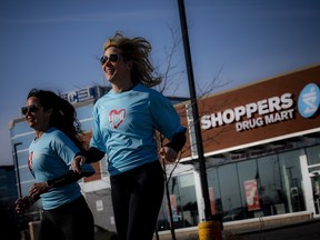 “All it takes is a ‘Yes, I’m going to do it,’ — just one,” said co-chair Leigh Harris. Co-chairs Liza Mrak and Harris jogged past Shoppers Drug Mart wearing their Run for Women T-shirts.