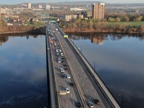 Cars are lined up along the McDonald Cartier bridge between Gatineau and Ottawa as the Ottawa Police Service screen travellers entering Ontario from Quebec.