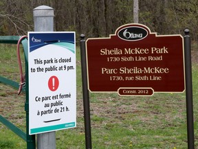 A sign at Sheila McKee Park in Dunrobin  advising of a 9 p.m. closing time. TONY CALDWELL/Postmedia