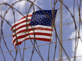 A U.S. flag flies at Camp V (Camp 5) inside Camp Delta in U.S. Naval Station in Guantanamo Bay, Cuba, 2007.