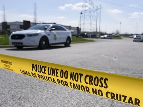 Police caution tape blocks the entrance to the site of a mass shooting at a FedEx facility in Indianapolis, Indiana on Friday, April 16, 2021.