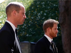 Britain's Prince William, Duke of Cambridge (L) and Britain's Prince Harry, Duke of Sussex follow the coffin during the ceremonial funeral procession of Britain's Prince Philip, Duke of Edinburgh to St George's Chapel in Windsor Castle in Windsor,, on April 17, 2021.