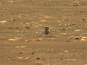 This NASA photo was taken after the first flight of NASA's Ingenuity Mars Helicopter  and the first powered, controlled flight on another planet,  captured by Mastcam-Z, a pair of zoomable cameras aboard NASA's Perseverance Mars rover, on April 19, 2021.