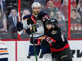 Ottawa Senators centre Clark Bishop (62) elbows Edmonton Oilers centre Leon Draisaitl during the first period.