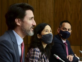 Prime Minister Justin Trudeau, left to right, Chief Public Health Officer Dr. Theresa Tam and Dr. Howard Njoo, Deputy Chief Public Health Officer, provide an update on the COVID pandemic during a press conference.