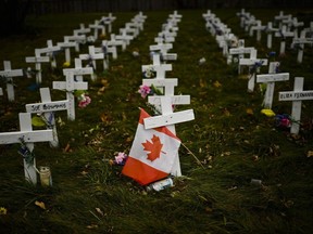 Crosses are displayed in memory of the elderly who died from COVID-19 at the Camilla Care Community facility during the COVID-19 pandemic in Mississauga, Ont., on Thursday, November 19, 2020.