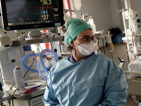 Medical workers work in the Intensive Care Unit (ICU) where patients suffering from the coronavirus disease (COVID-19).