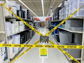 FILE PHOTO: An aisle of non-essential goods is seen cordoned off at a Walmart store, as new measures are imposed on big box stores due to the coronavirus disease (COVID-19) pandemic, in Toronto, Ontario, Canada April 8, 2021.