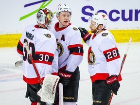 Apr 19, 2021;  Ottawa Senators goaltender Matt Murray (30) celebrate win over Calgary Flames with Brady Tkachuk (7) and right wing Connor Brown (28) at Scotiabank Saddledome.