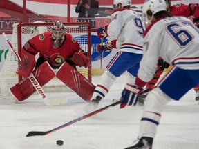 File photo/ Montreal Canadiens right wing Michael Frolik (67) shoots on Ottawa Senators goalie Filip Gustavsson (32) in the first period at the Canadian Tire Centre.