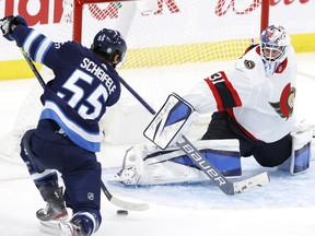 Winnipeg Jets center Mark Scheifele gets set to shoot on Ottawa Senators goaltender Anton Forsberg in the third period at Bell MTS Place on Monday.