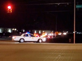Police is seen at a street following a shooting incident at a FedEx facility in Indianapolis, Indiana, U.S. April 16, 2021, in this still image taken from a video.