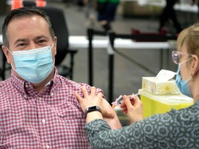 Premier Jason Kenney posted this photo to his Twitter account of him receiving his first dose of the COVID-19 vaccine in Edmonton.