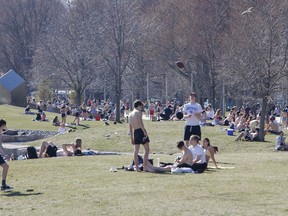 Sunshine and summer-like temperatures drew people outdoors and along Breakwater Park in Kingston on Thursday afternoon during the first day of the new provincial stay-at-home order.