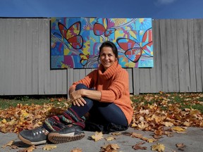 OTTAWA - Artist Claudia Salguero in front of her mural at the Ottawa Community Housing office at 731 Chapel Street in Ottawa Tuesday October 20, 2020.