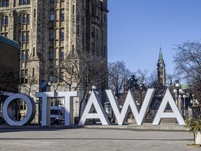 The OTTAWA sign in the ByWard Market sat void of tourists or other visitors last April.